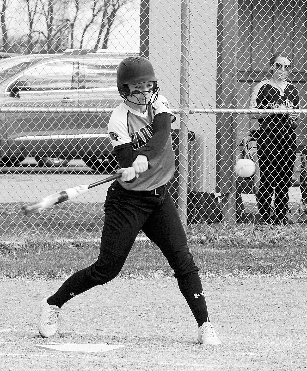 McKenna Schneider makes a hit for a base hit against the PCN Grizzles. Photo by Larry Stokke.