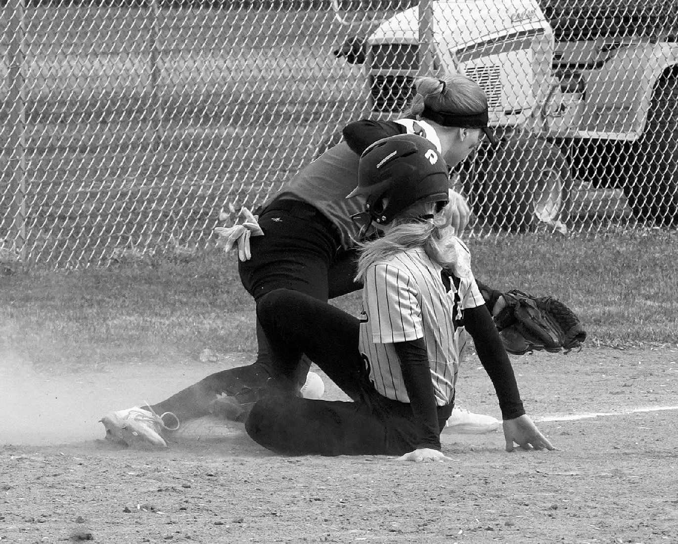 The Grizzlies Graesen Larson gets safely on 3rd base in the game against the Cards. Photo by Larry Stokke.