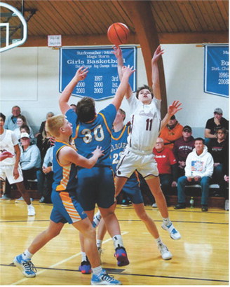 Chase Girodat puts up a shot and went to the line and made two free throws in the win over Benson County. Photo by Larry Stokke