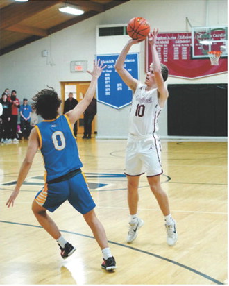 Maddux Stremick eyes the basket and drops one of his four 3-point shots in the hole. Photo by Larry Stokke