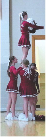 The Cardinal Cheer Squad played free throws with the student section. Photo by Larry Stokke