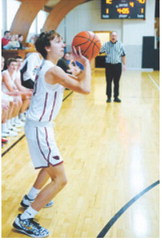 Grady Pankratz came into the game and dropped in three 3-point baskets in the 4th quarter. Photo by Larry Stokke