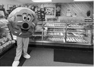 Bread Pan Bakery's new donut mascot made its debut during the bakery's National Donut Day celebration. The bakery set a goal of producing 2,700 donuts overnight and sold out in less than seven hours. Submitted photo