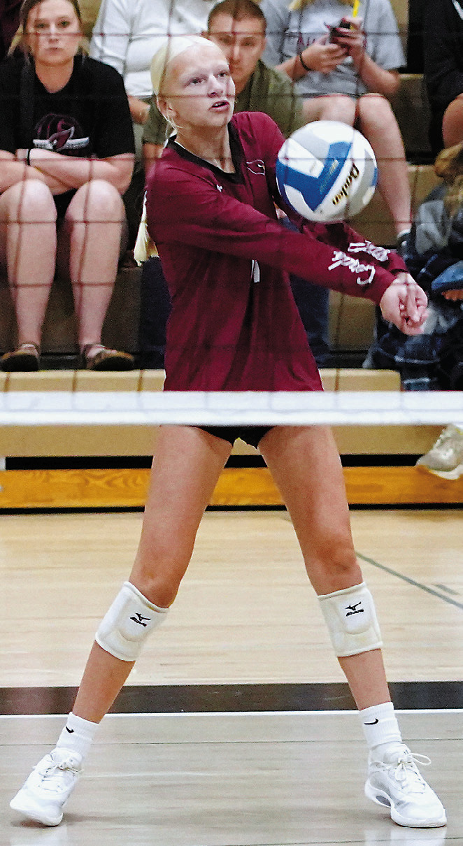 Mya Swanson with a pass to a teammate in the front row. Photo by Larry Stokke.