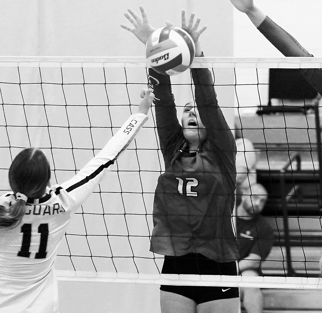 Kemi Morstad stuff blocks a Jaguar player. Photo by Larry Stokke.