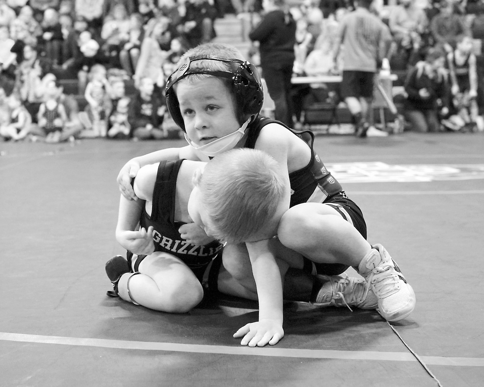 North Border wrestler Gunner McKay taking on his opponent. Photo by Larry Stokke.