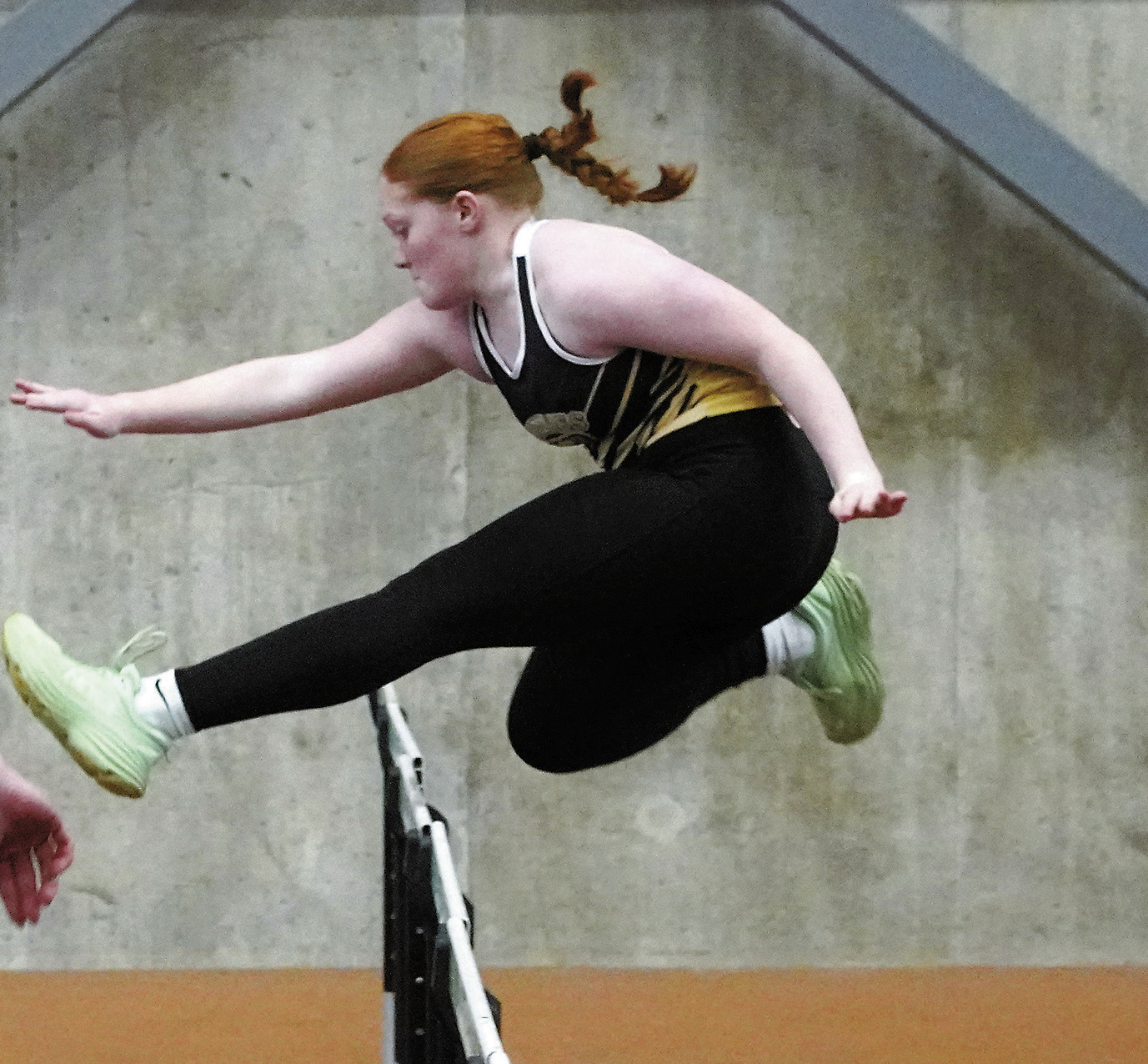 Amelia Carpenter shows great form jumping hurdles at the PCN Invitational on March 29. Photo by Larry Stokke.