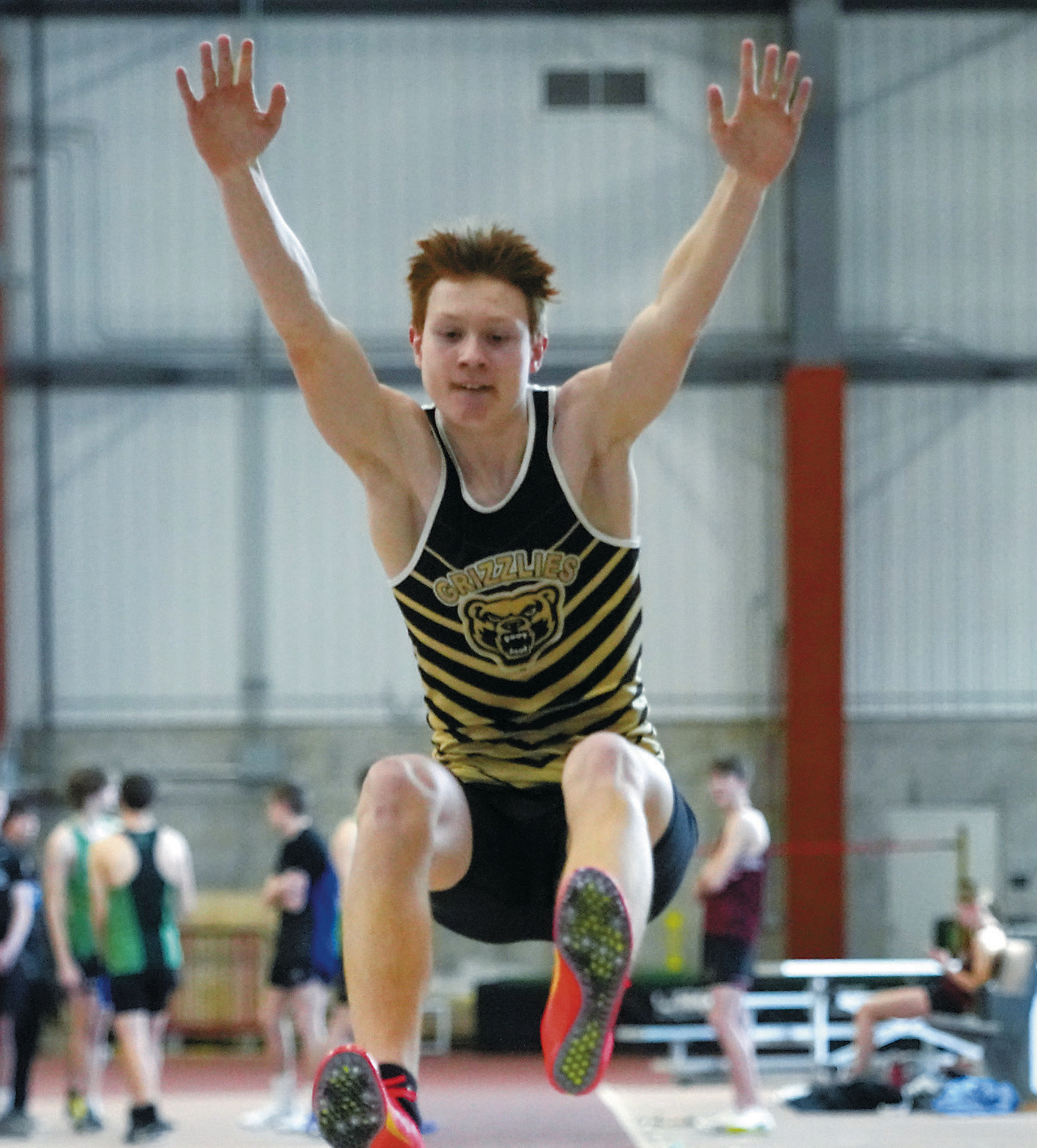 Garrett Willits had a long jump of 17' 3', good for a tie for 10th place. Photo by Larry Stokke.