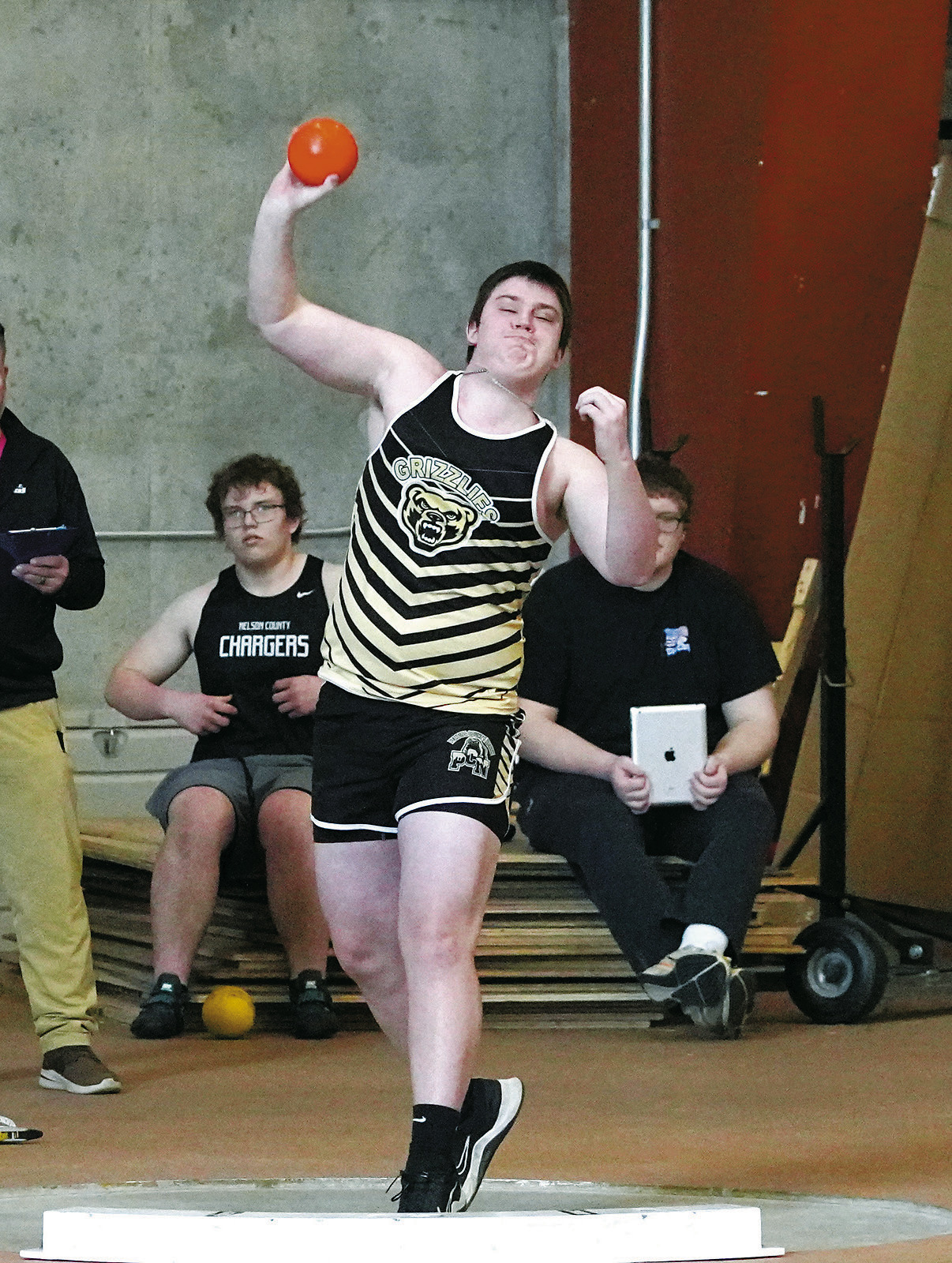 David O'Connor shows great concentration while throwing the shot put 28' 9.75'. Photo by Larry Stokke.