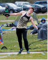 Christopher Longtin shows concentration while competing in the discus at the meet in Larimore on May 9. Photo by Larry Stokke