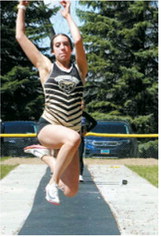 Audrey Longtine claimed first place in the long jump with a leap of 16 feet, 2¼ inches. Photo by Larry Stokke