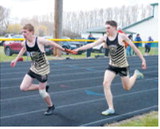 Owen Crosby and Nolan Pelletier compete in the 4x400 relay alongside teammates Connor O’Hara and Ethan Kendell. The quartet finished sixth at the meet. Photo by Larry Stokke