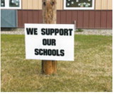 “We support our schools” signs meant to show support