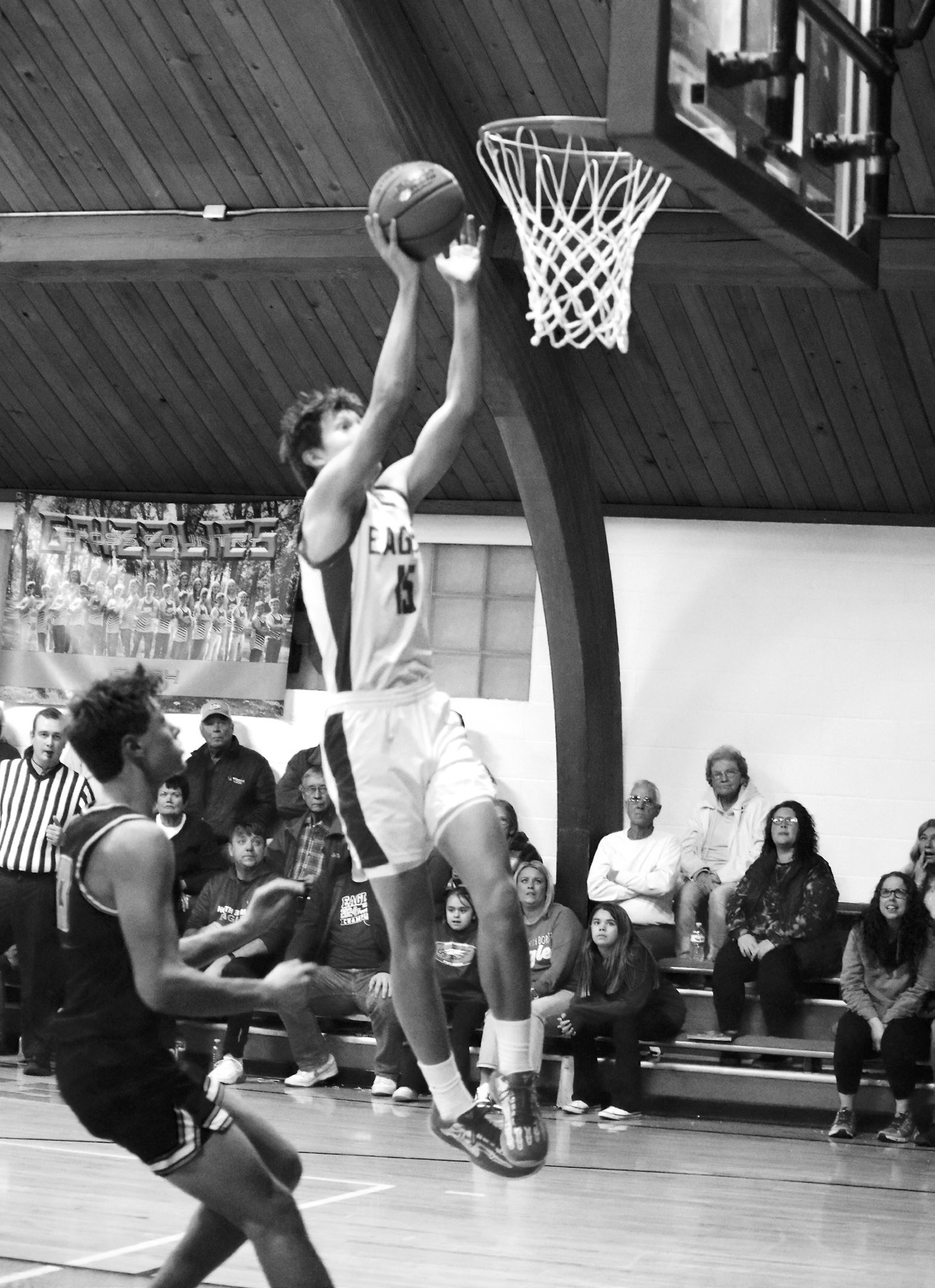 Garret Willits goes up for a hoop. Photo by Ashley Schafer.