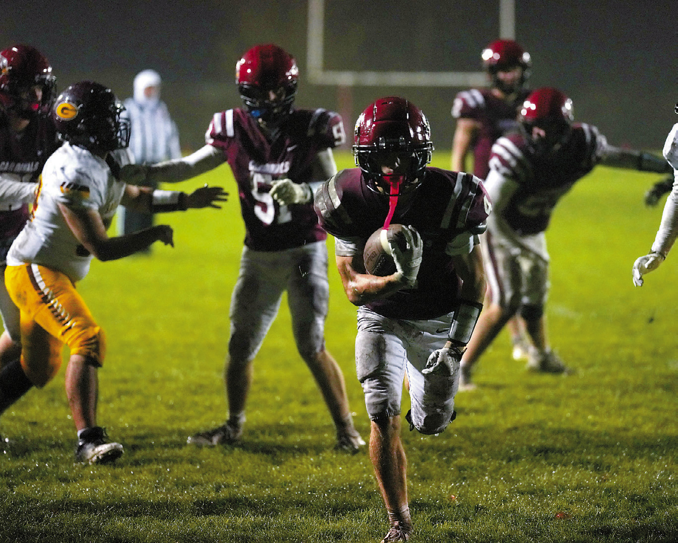 Sam Davis runs in the extra points after Theo Romfo's touchdown, making the score 34-0. Photo by Larry Stokke.