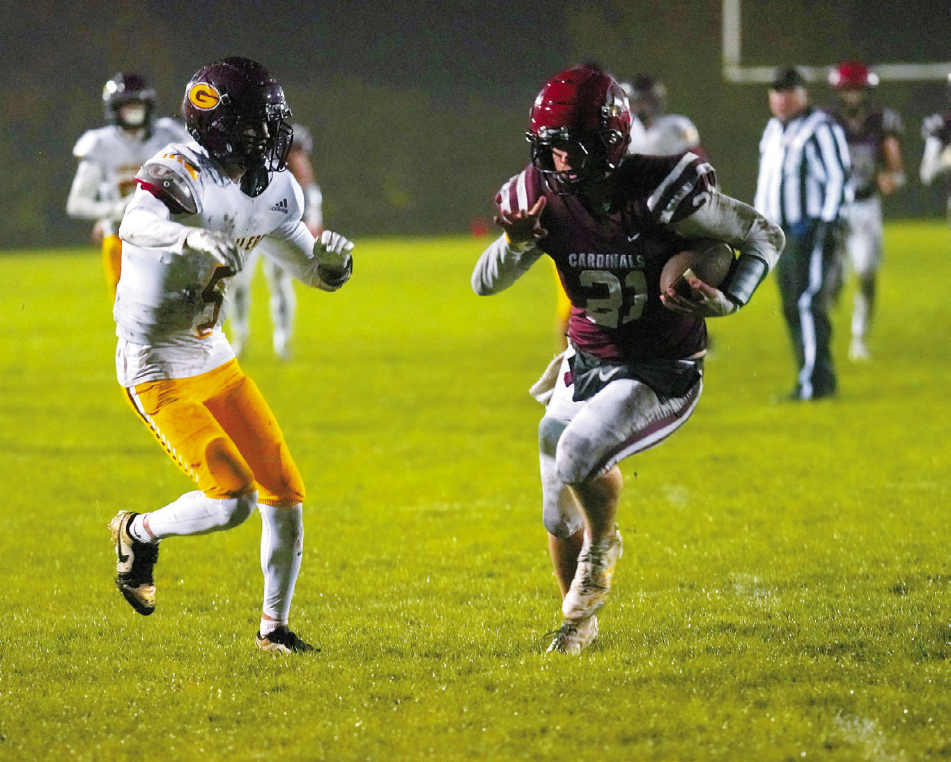 FM State Bank's Player of the Game Theo Romfo with a 31-yard pass runs in for a touchdown in the Cardinals' win over Grafton. Photo by Larry Stokke.