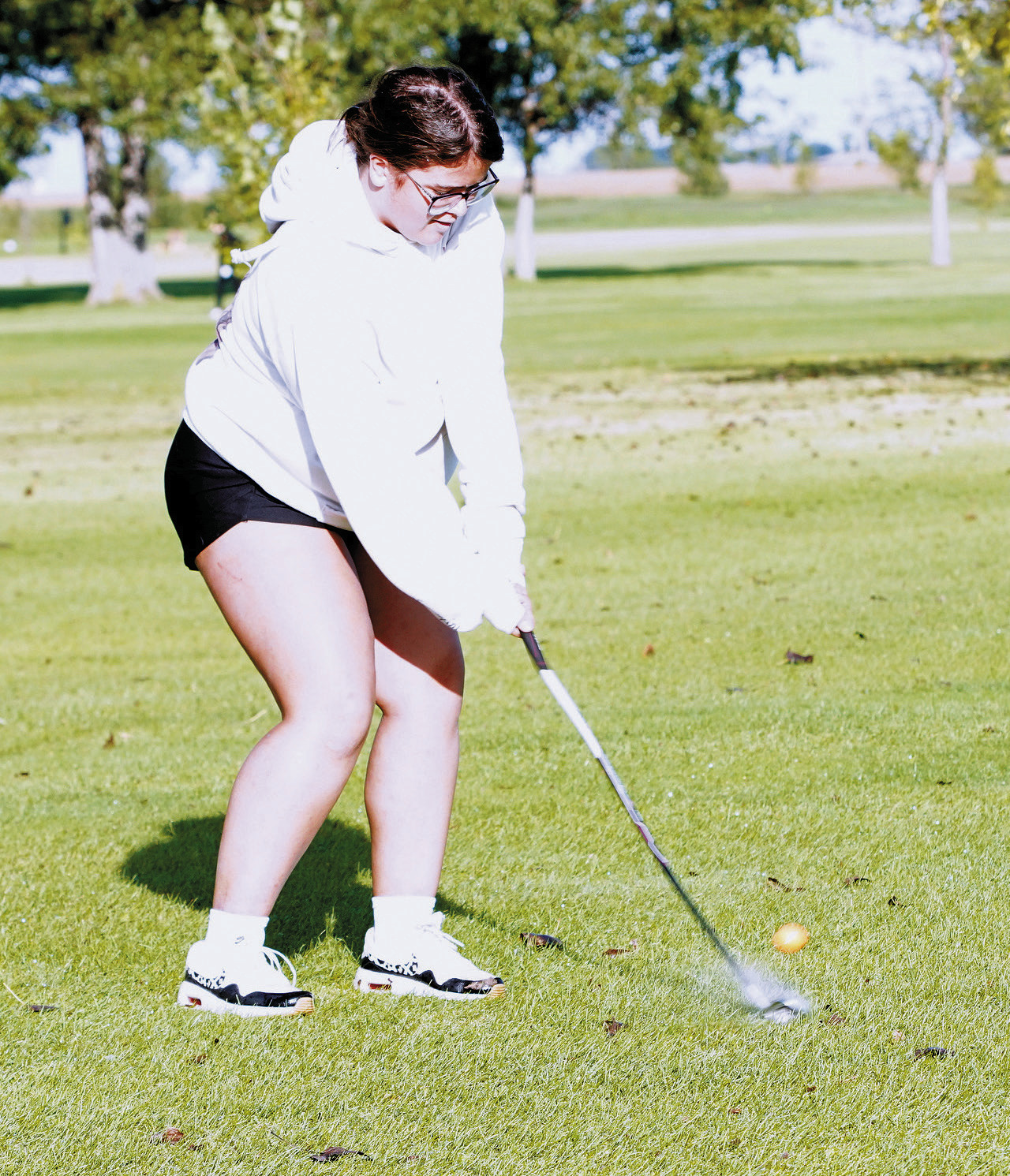 Makayla Bartlett's second hit to get the ball up on the green. Photo by Larry Stokke.