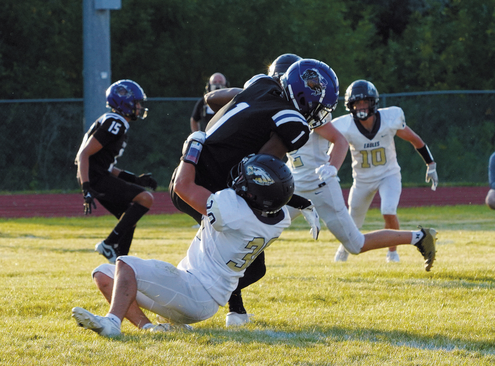 Brody Berg tackles Four Winds QB Kashton Keja in the Eagles win of the first game of the season. Photo by Larry Stokke.