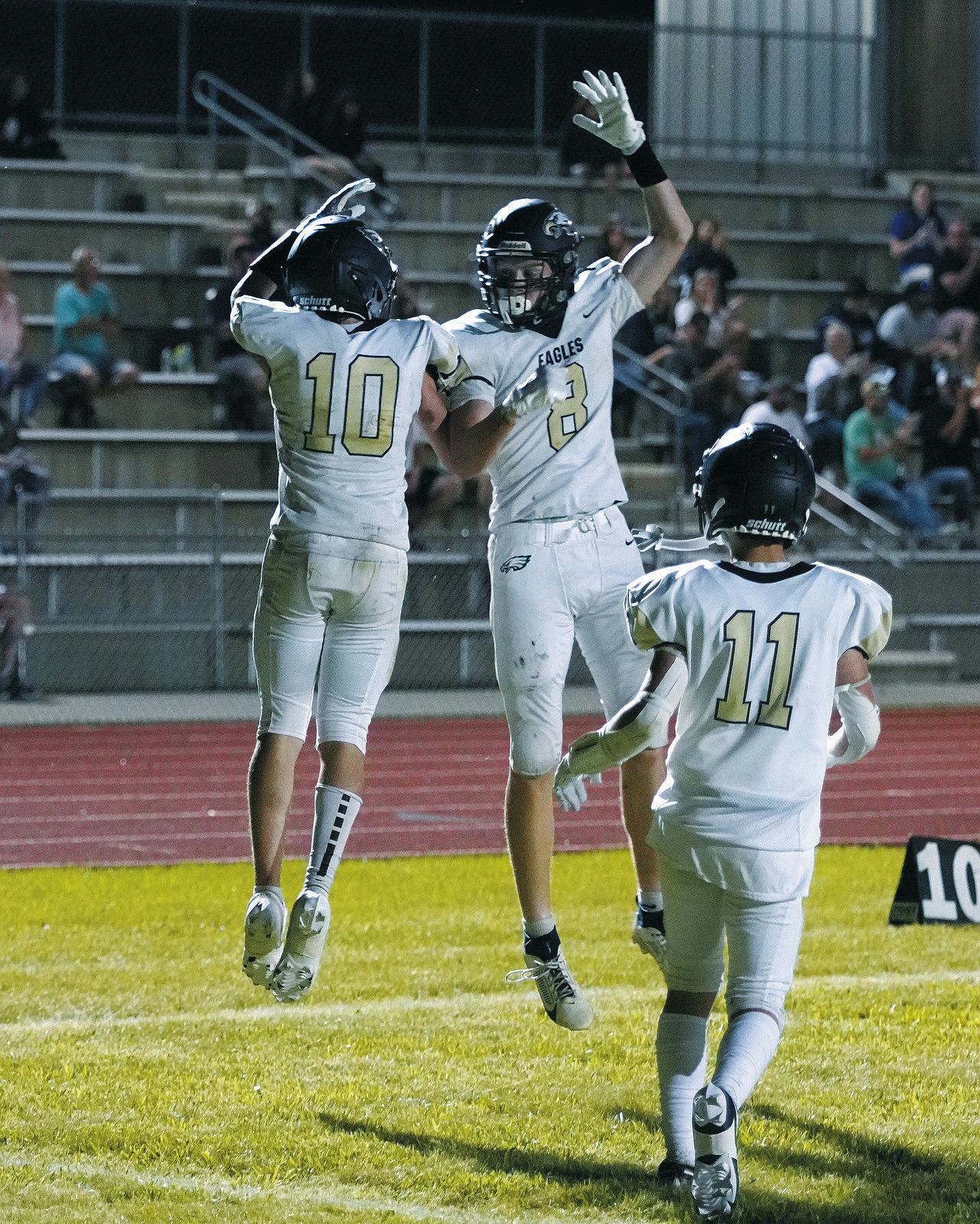 Kadem Moore and Garrett Willits celebrate after scoring against the Four Winds Indians. Photo by Larry Stokke.