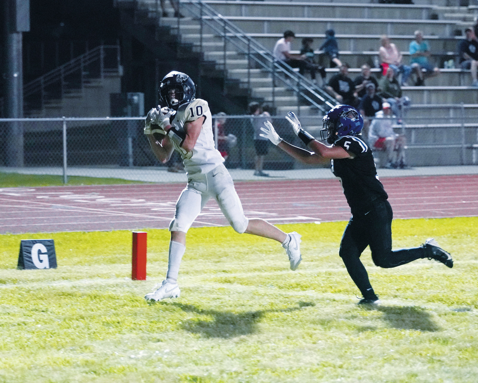 Kaden Moore with a catch at the goal line to score for the Eagles. Photo by Larry Stokke.