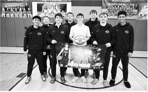 Kaden Moore scored his 1,000th career point for the North Border Eagles, in a game Minto on January 20th... Pictured is Kaden with his teammates, and with a basketball commemorating the moment. Congrats Kaden Moore!