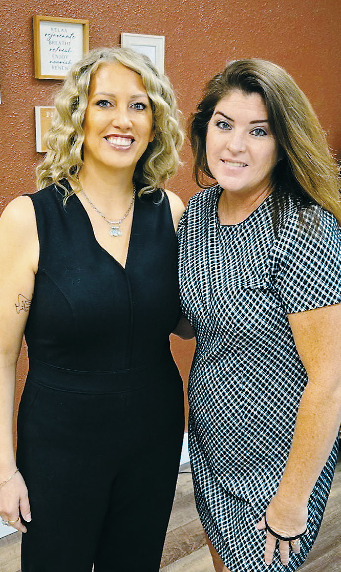 Runa Anderson (left) and Sabrina Moen (right) pose for a photo at their grand opening for NV2B on Sept. 20.