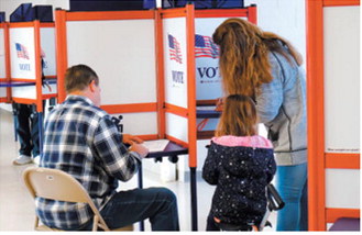 Voters cast ballots at the Hillside Aquatic Complex in Bismarck on Election Day, Nov. 5, 2024. Michael Achterling/North Dakota Monitor