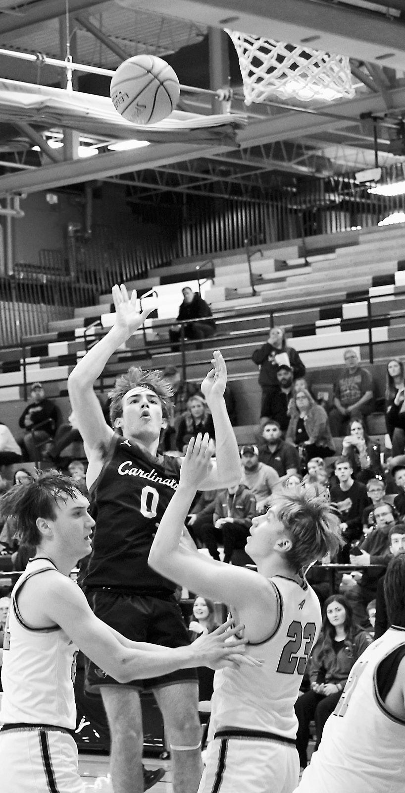 Co-Player of the Game Jayden Lee drops in a basket from the top of the key. Photo by Larry Stokke.