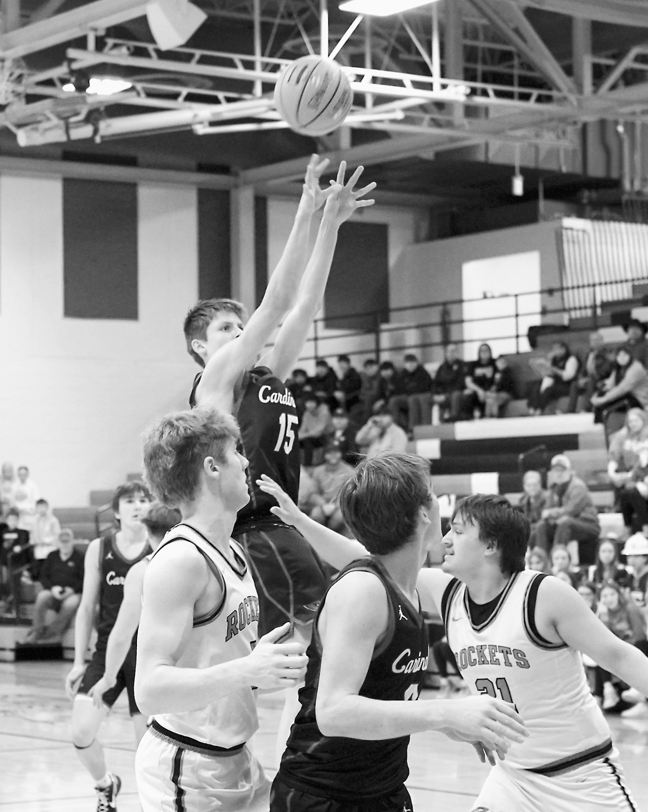 TJ Henderson adds a basket to the Cards' score. Photo by Larry Stokke.