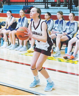 FM Bank Player of the Game Ary Schaefer eyes the basket and drops in a 3-point shot and had a team high 20 points in the game with Bottineau. Photo by Larry Stokke