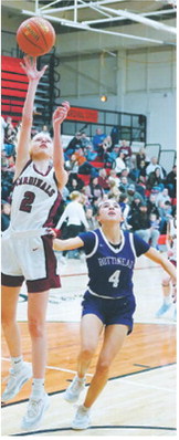 Mya Swanson with a fast break to the basket and lays the ball in the hole. Photo by Larry Stokke