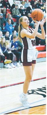 Hallie Overby puts up a shot from the 3-point line in the game Jan. 19 against Bottineau. Photo by Larry Stokke