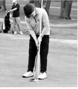 Baylor Tryan lines up a short putt during the Larimore meet and finished with a score of 93. Photo by Larry Stokke