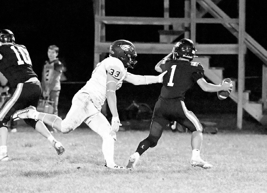Kade Schafer sacking the Charger’s quarterback. Photo by Ashley Schafer.