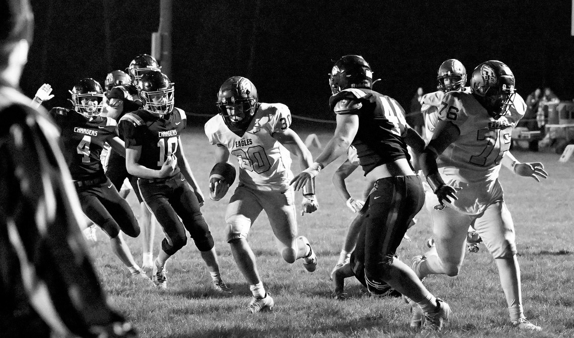 Brody Berg with one of his 16 rushes for a career high 210 yards against Nelson County. Photo by Ashley Schafer.