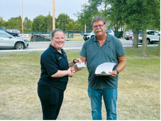 Cavalier County Farm Bureau President Paul Henderson, right, presents a $2,500 donation to Hope Thorlakson of the Langdon Ambulance Service. Photo by Megan Overby, NDFB Northeast Field representative