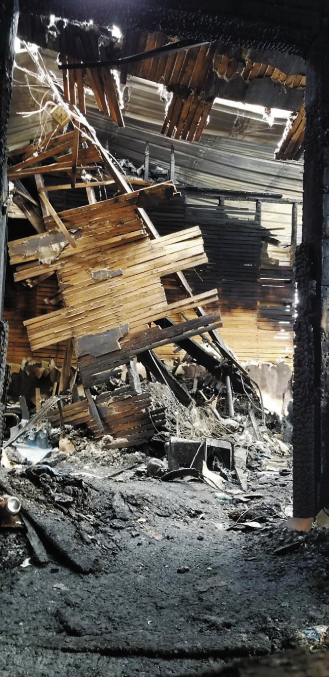 The collapsed roof from inside the building. Photo by DJ Bartley