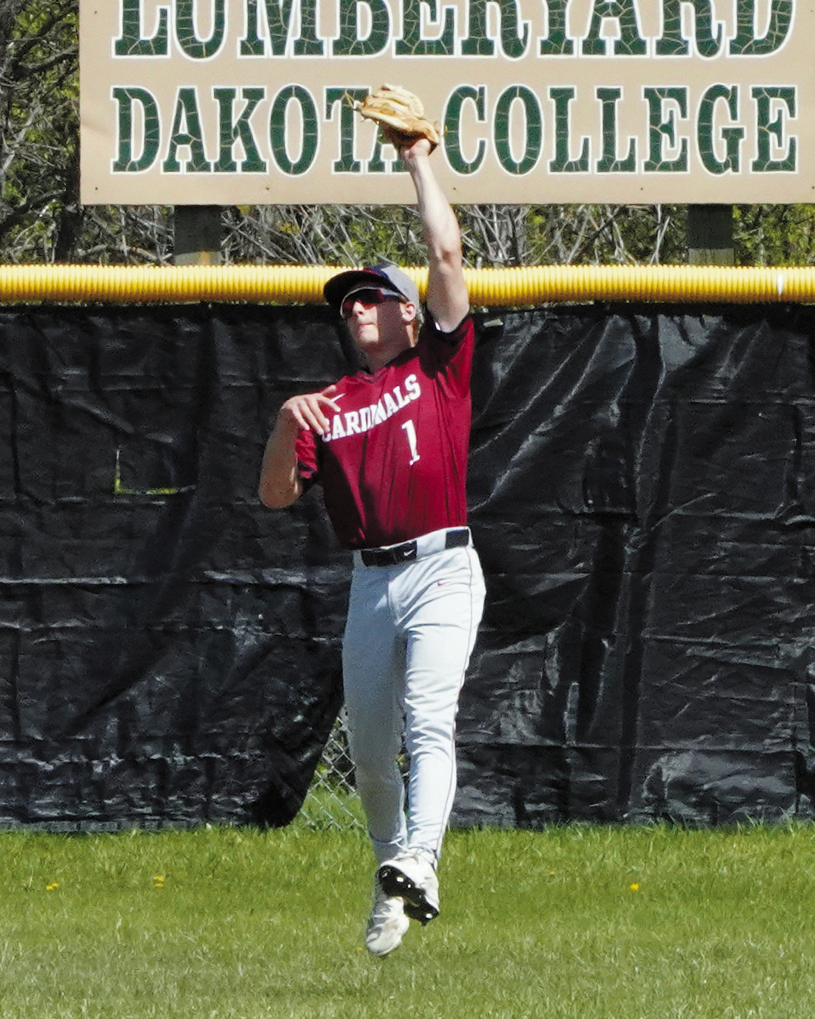 Sam Davis with a catch deep in the outfield. Photo by Larry Stokke.