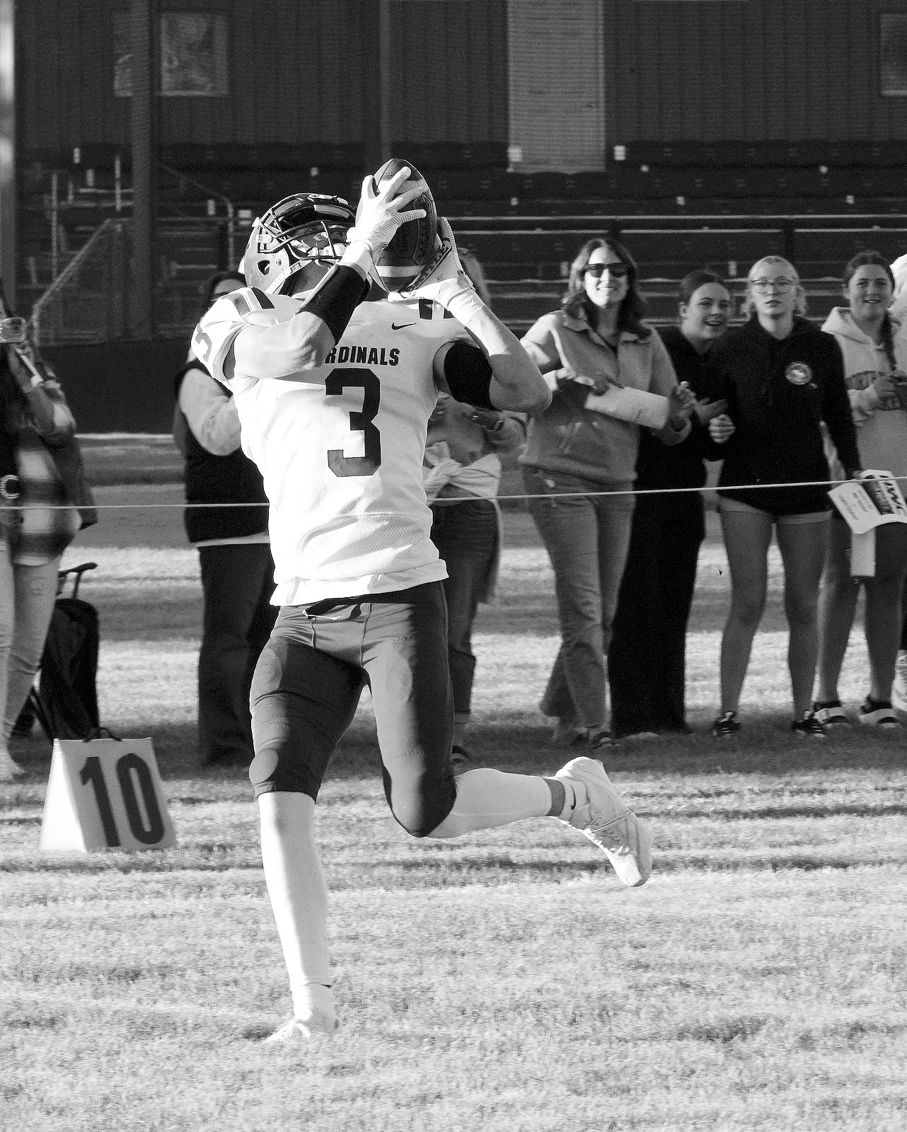 Cody Amble with a great reception and a touchdown for the Cards in their win over the Hornets. Photo by Larry Stokke.