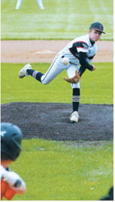 Bensen Fetsch eyes the Drayton batter and sends a strike across the plate. Photo by Larry Stokke