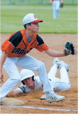 Austin Wenzel dives into third base ahead of the tag in the Red Sox's win over Drayton in Langdon on June 16. Photo by Larry Stokke