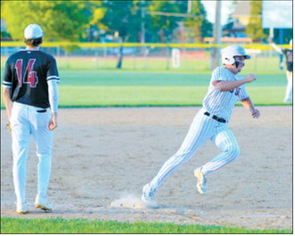 Dawson Downs rounds third base on his way to scoring a run for the Red Sox during action June 11. Photo by Larry Stokke