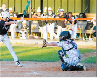 Landon Schneider keeps his eye on the ball as he receives a strike behind the plate during the Red Sox’s win over Grafton on June 11. Photo by Larry Stokke