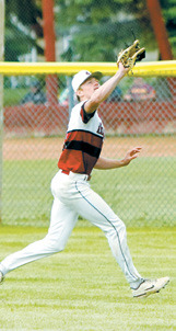 Bensen Fetsch connects for a base hit during Langdon Area/Munich’s victory over Carrington on June 15. Photo by Larry Stokke