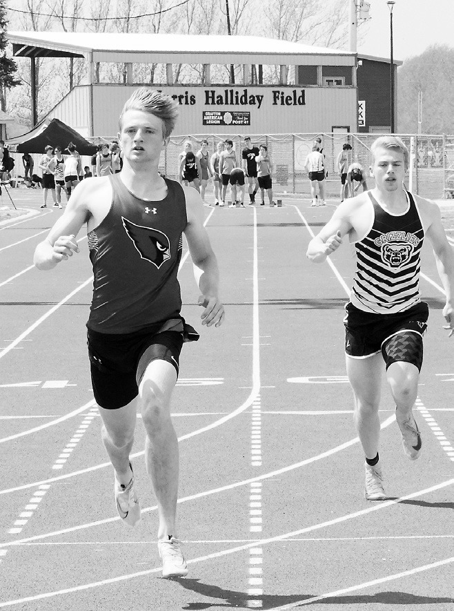 Cody Amble finished 2nd in the 100 meter dash and the Grizzlies' Jesse Eisenbeis finished in 5th place at Grafton on May 12. Photo by Larry Stokke.