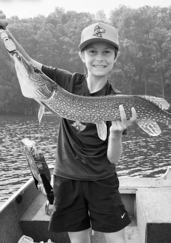 Prestyn, who just turned 14, shows off his great catch Red Willow lake.