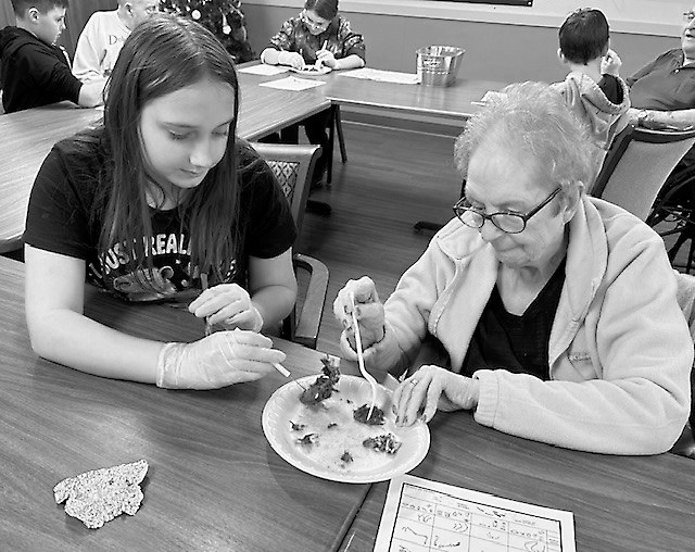 job and learned a lot about animals camouflaged in their natural habitats. Nolah and Darlene picking through their ‘owl pellets.’