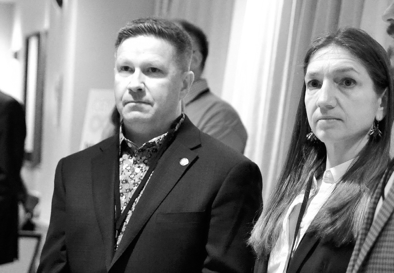 Democratic-NPL candidates Trygve Hammer, left, and Katrina Christiansen listen to speakers at the party’s convention in Fargo on April 5, 2024. Hammer is running for U.S. House; Christiansen for U.S. Senate. (Jeff Beach/North Dakota Monitor)