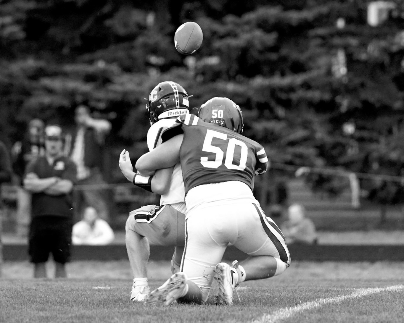 FM Bank Player of the Game Landon Schneider records a quarterback sack during the Cardinals’ win over Valley City. Schneider also made several tackles for loss. Photo by Larry Stokke