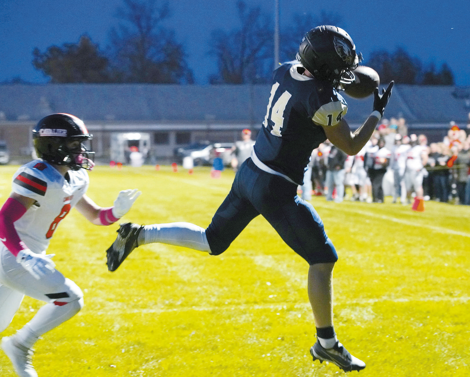 Colton Baily with a catch to add 6 points to the Eagles score. Photo by Larry Stokke.